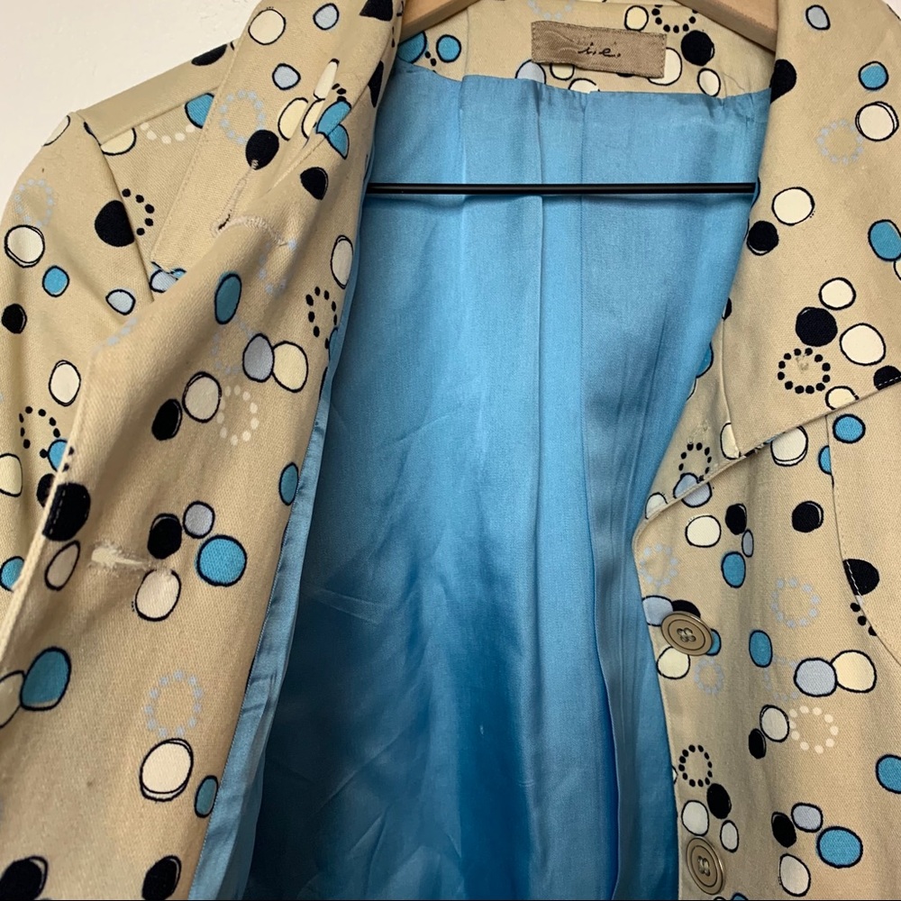 I.e. Tan trench coat with Mod circle design. - Picture 7 of 8